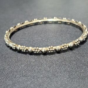 Gold tone textured bangle bracelet 7.75"
